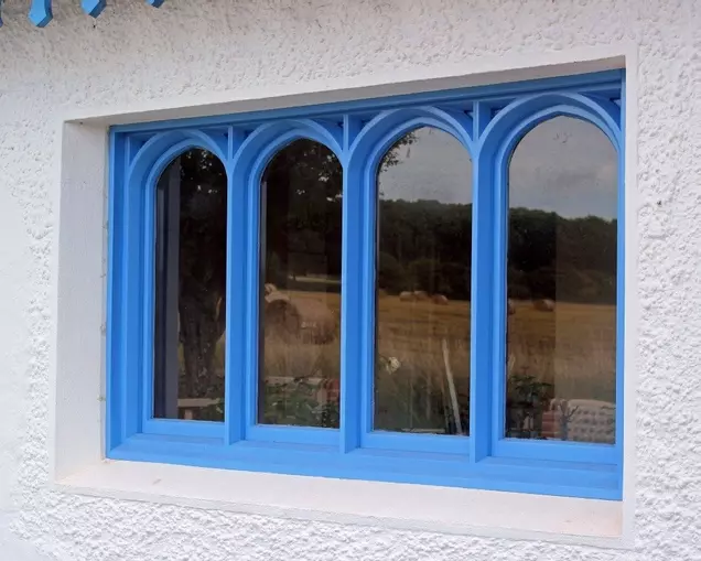 Gothic-arched hardwood window